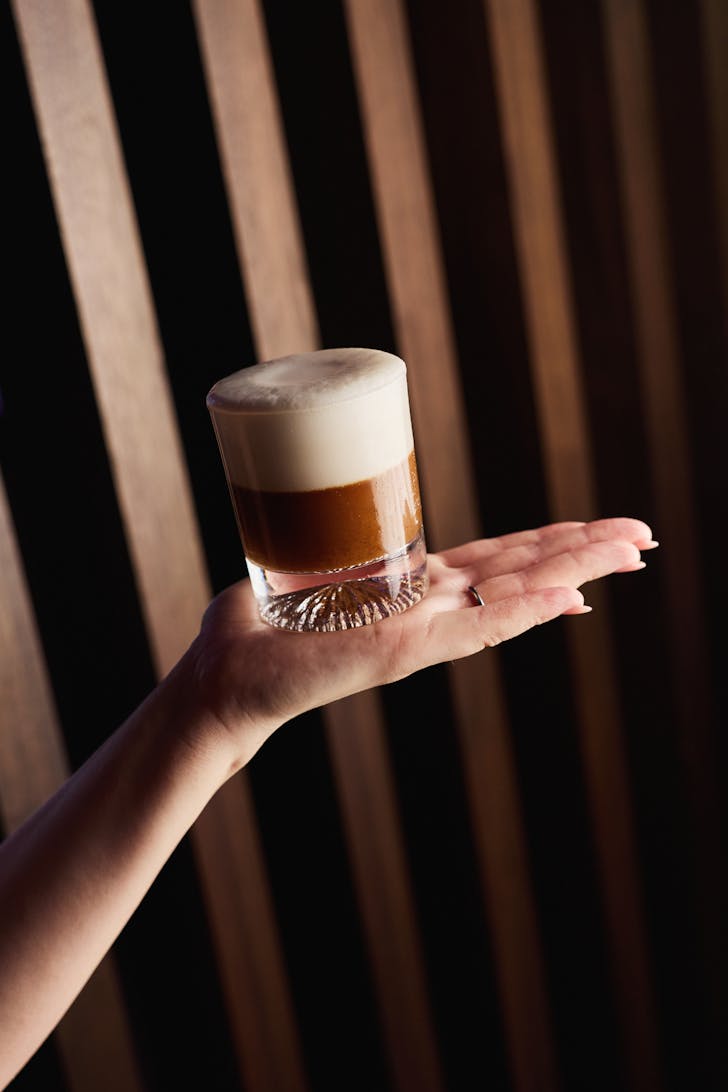 papi katsu golden days cocktail being held