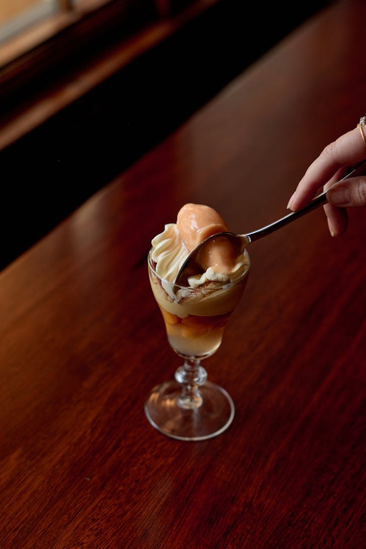 heritage restaurant peach trifle being scooped