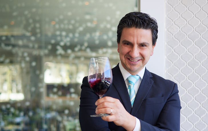 Michele Nocti with a glass of red wine