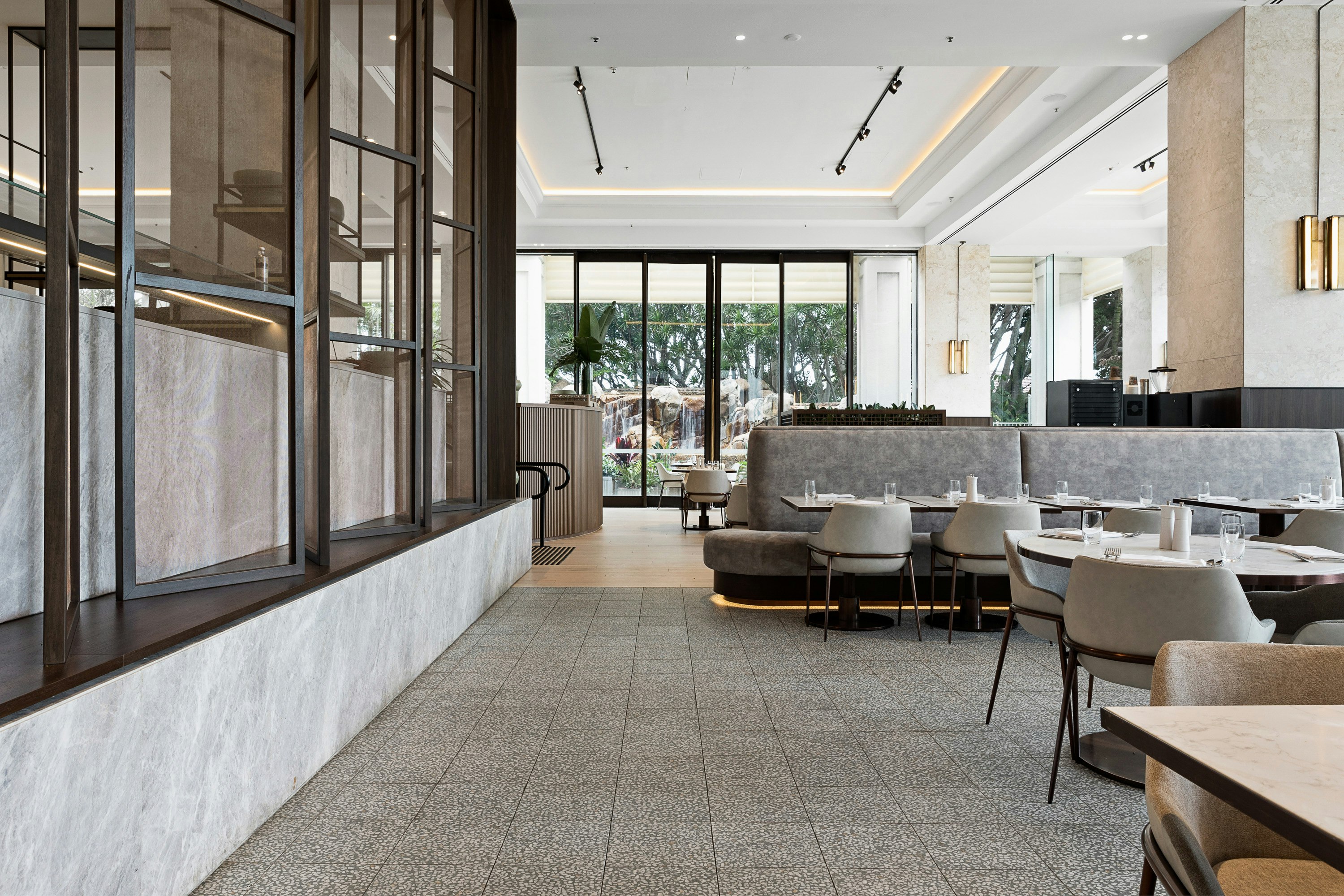 the slate grey dining room interior of a luxury resort