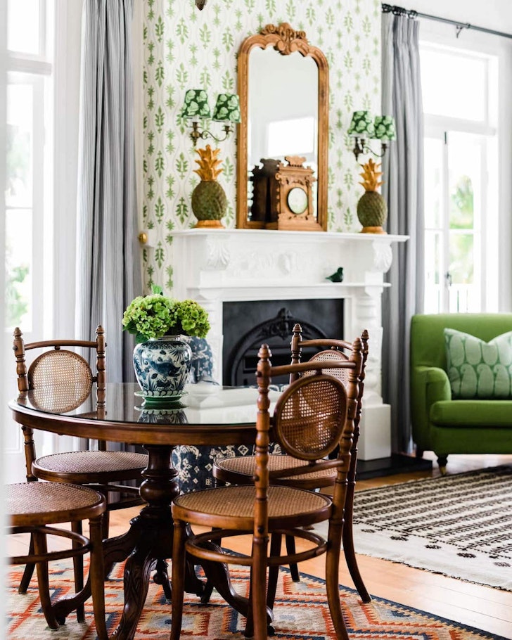 A table sits in front of a fireplace at Rangeview Cottage cosy cabin near Brisbane
