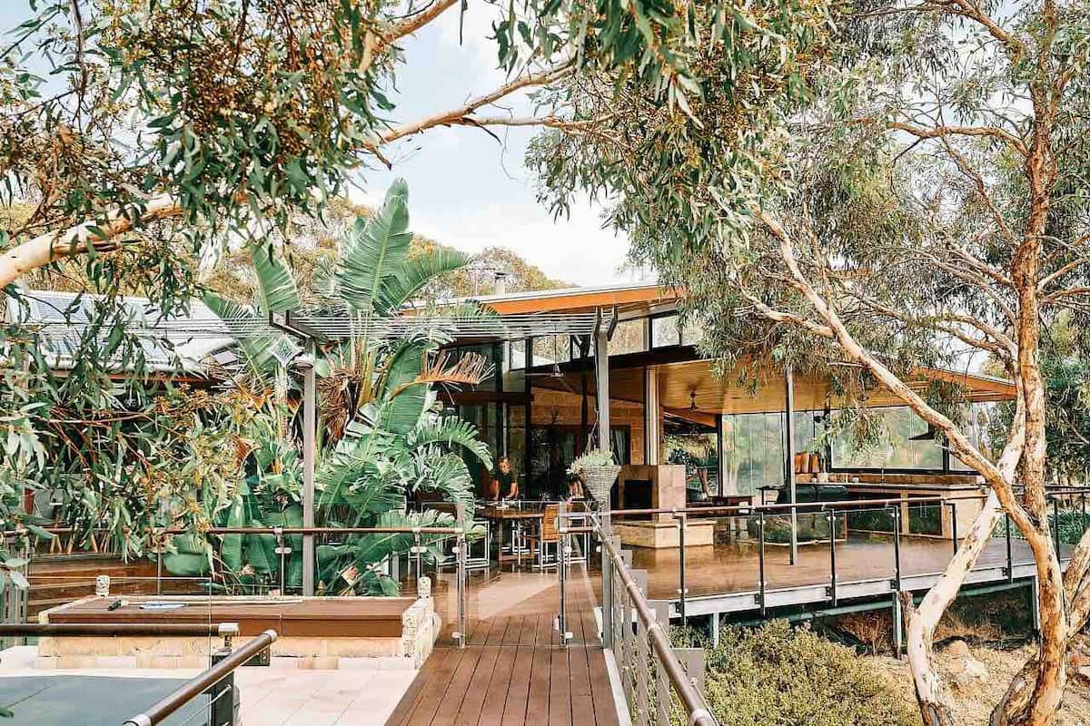 Natural bushland hides the front of a house