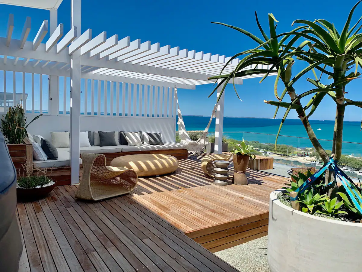 Balcony overlooking the ocean with a hammock