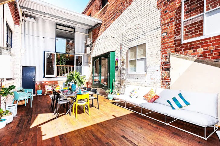 colourful outdoor inner courtyard with industrial accents