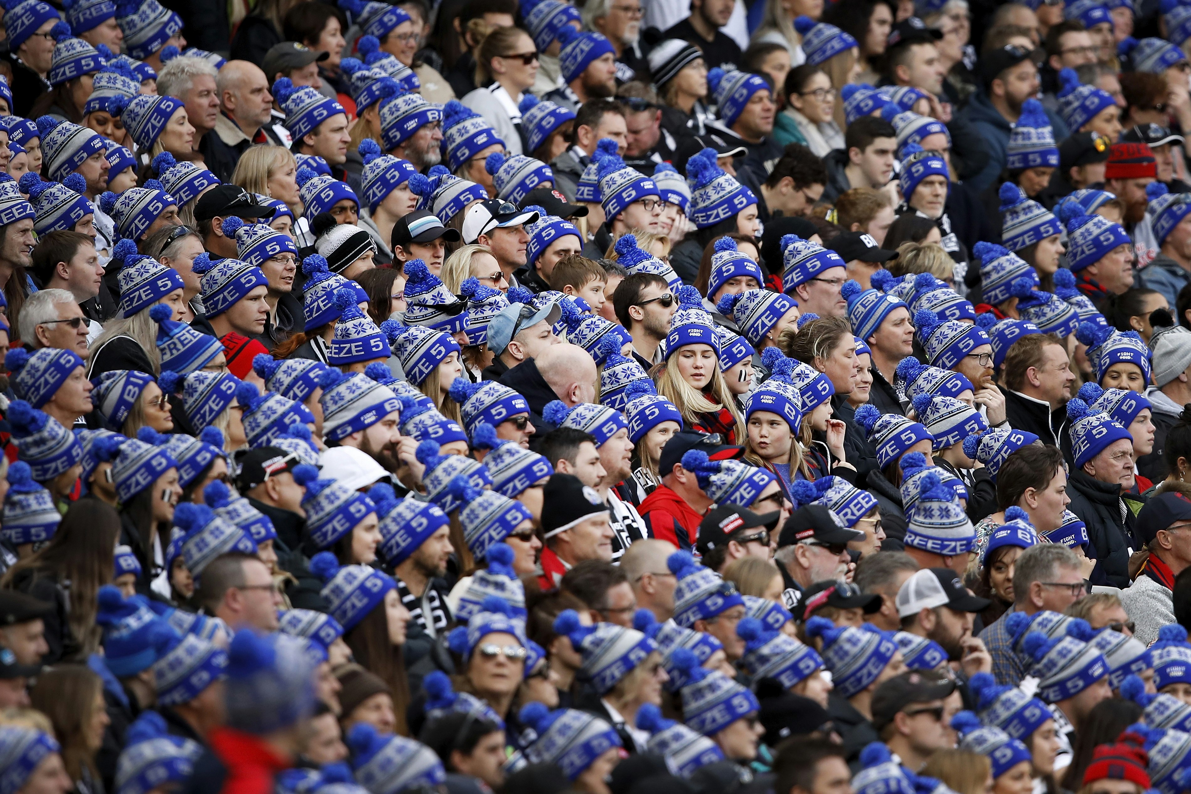 A crowd full of spectators wearing blue FightMND beanies.
