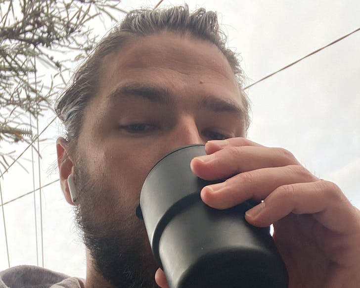simple swaps man with reusable coffee cup