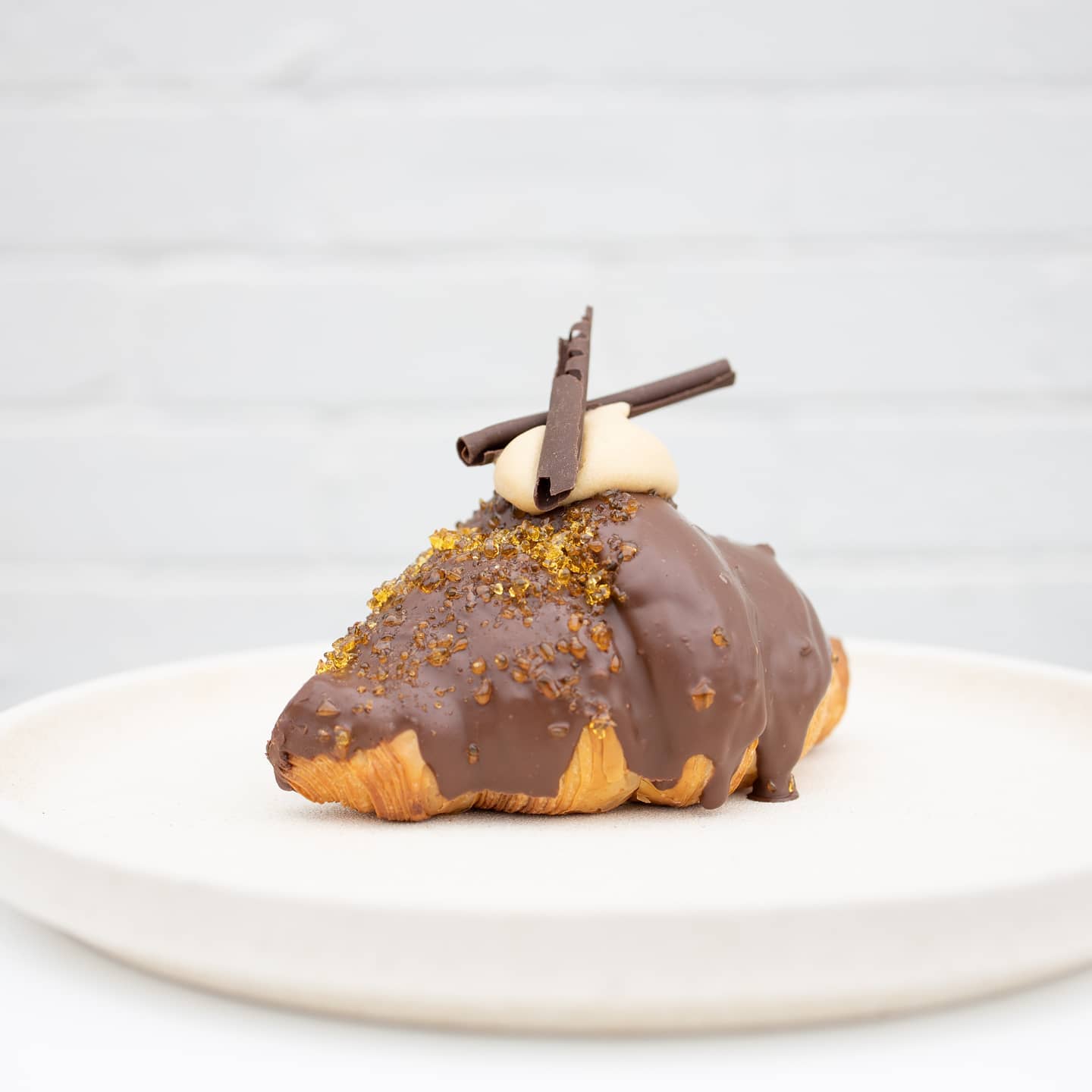 a chocolate dipped croissant
