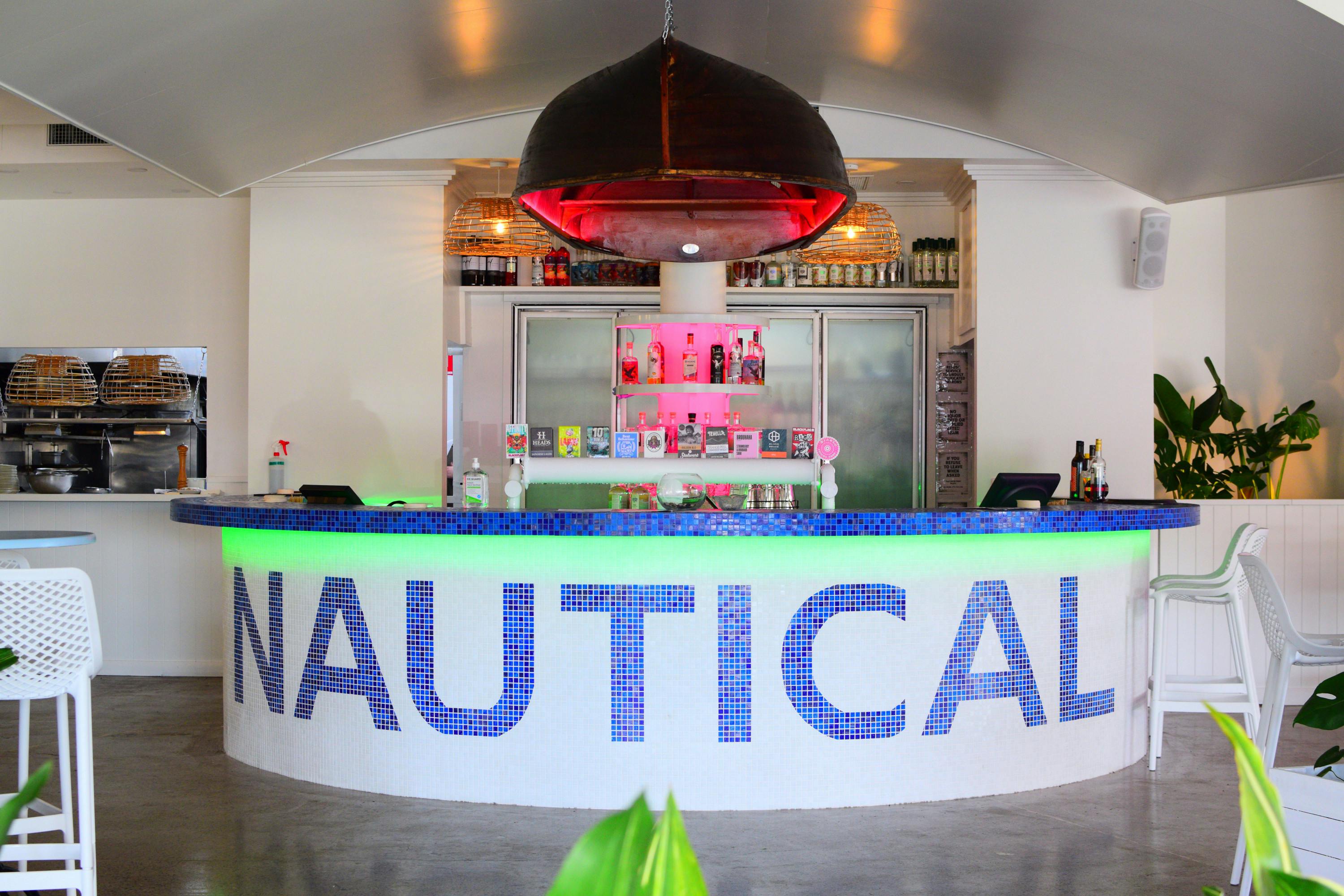 a white bar with a navy blue mosaic design that says 'nautical'