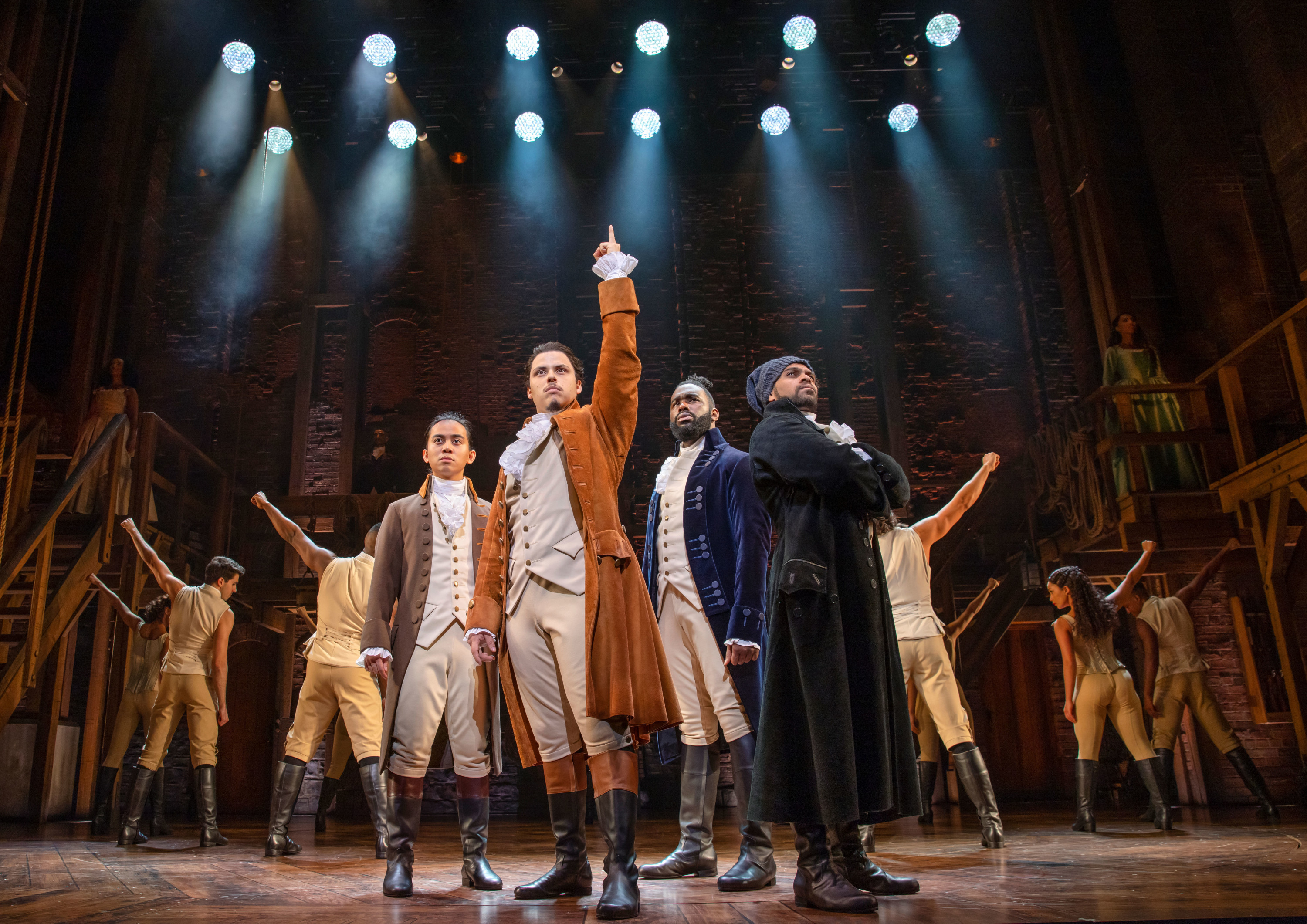 a photo of the australian cast of hamilton on stage