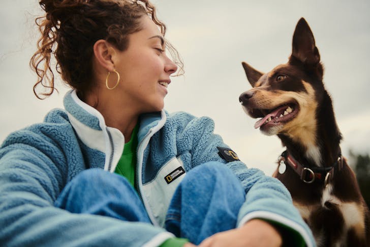 Woman sitting with her dog.