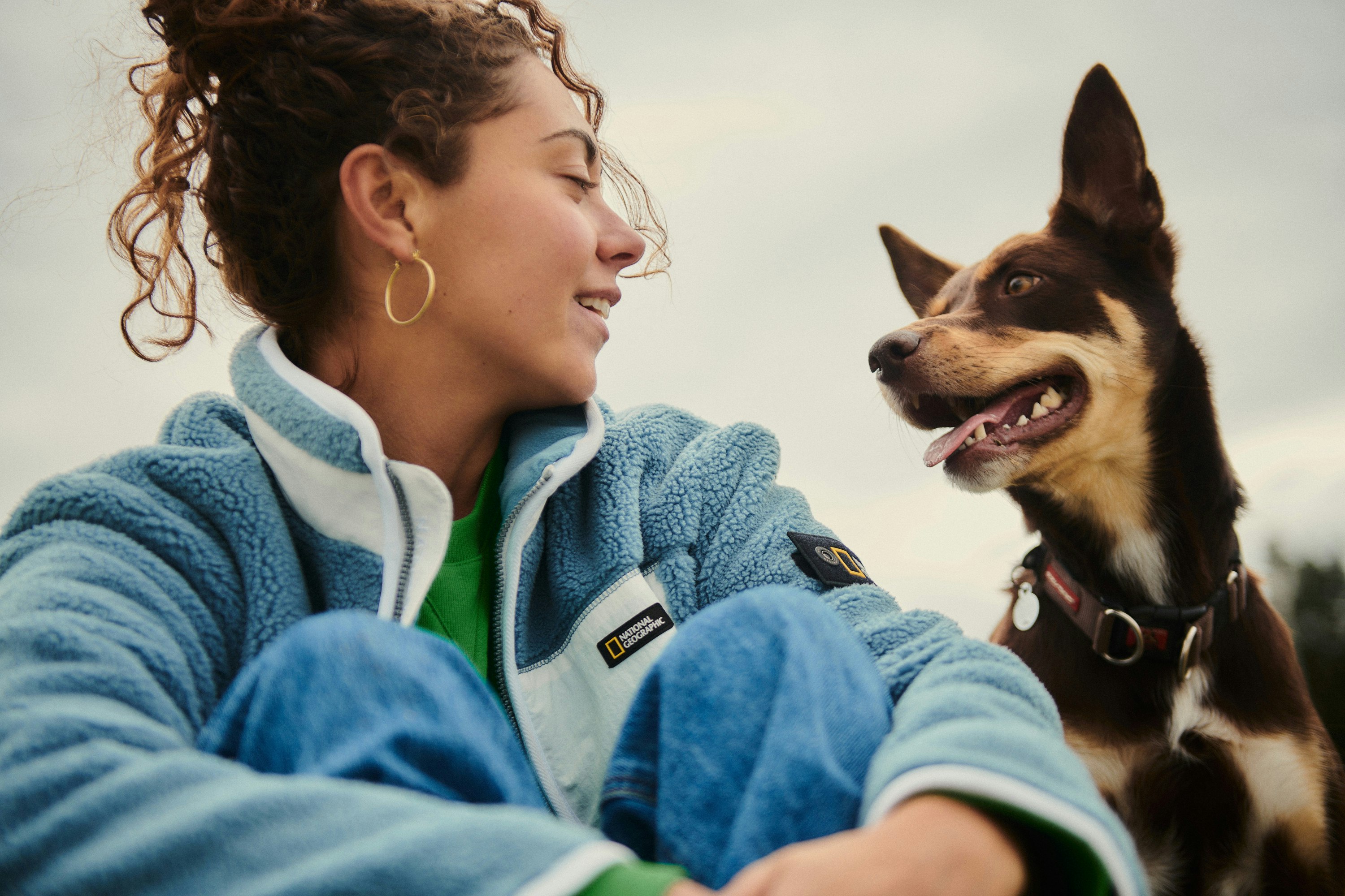 Woman sitting with her dog.