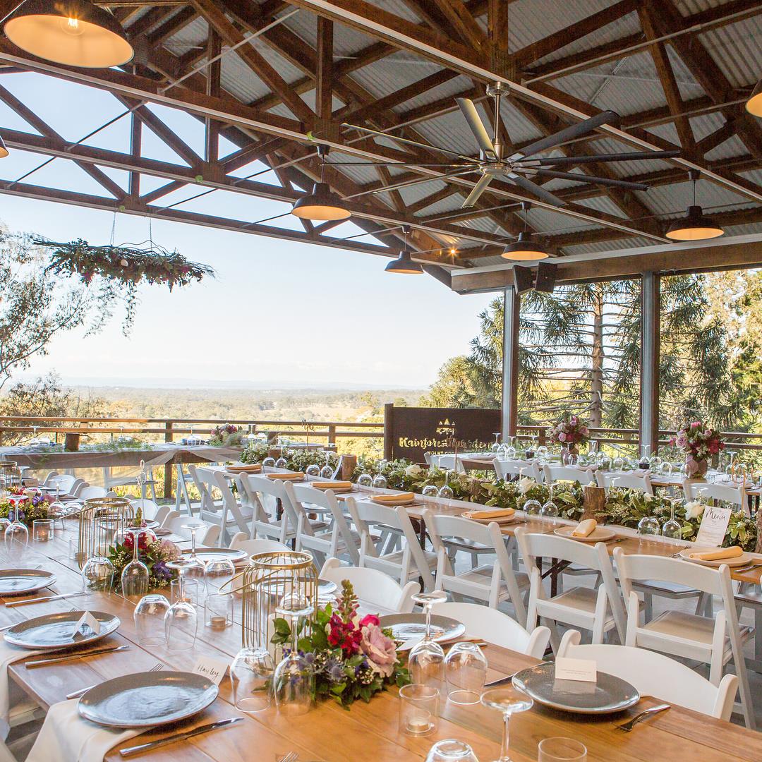 wedding tables on a verandah overlooking hills at a wedding venue near brisbane