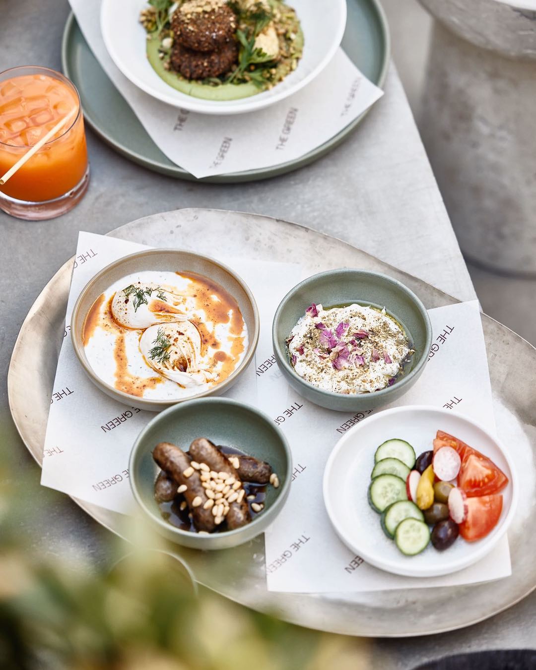 a tray of middle eastern breakfast dishes at the green, a cafe in brisbane