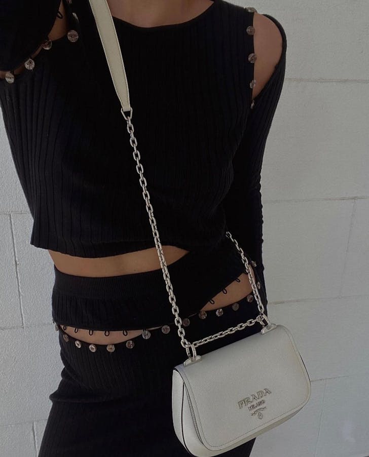 a woman in a black outfit