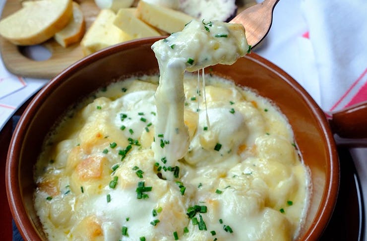A cheesy bowl of baked gnocchi.