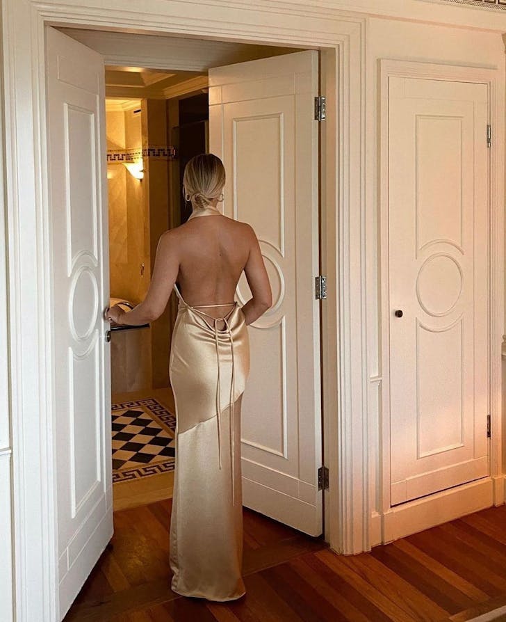a woman in a gold dress