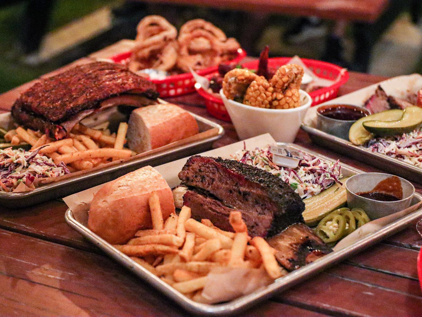 a tray of bbq meats and sides