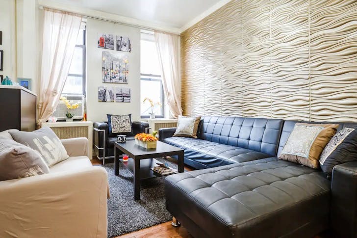 Cream room with three couches