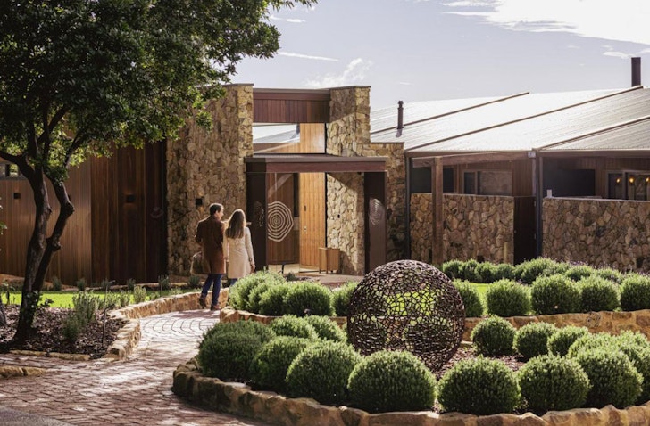 An exterior view of Sequoia Lodge with greenery. One of the best Adelaide Hills accommodation options