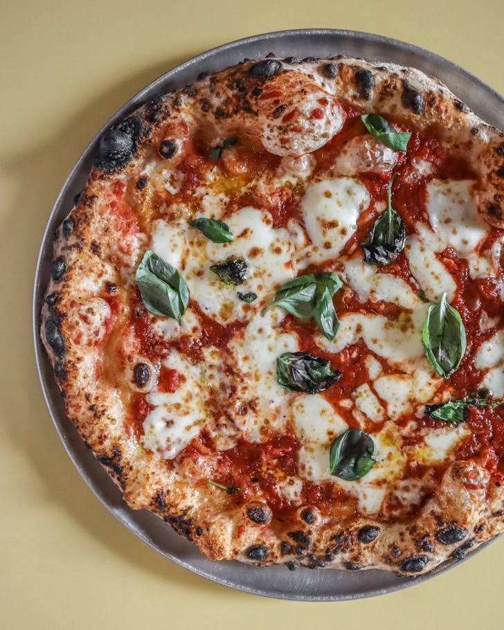 Tomato, buffalo mozzarella, fresh basil and extra virgin olive oil on Umu Pizzaâs sourdough base