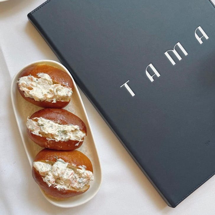 Menu next to three rolls.