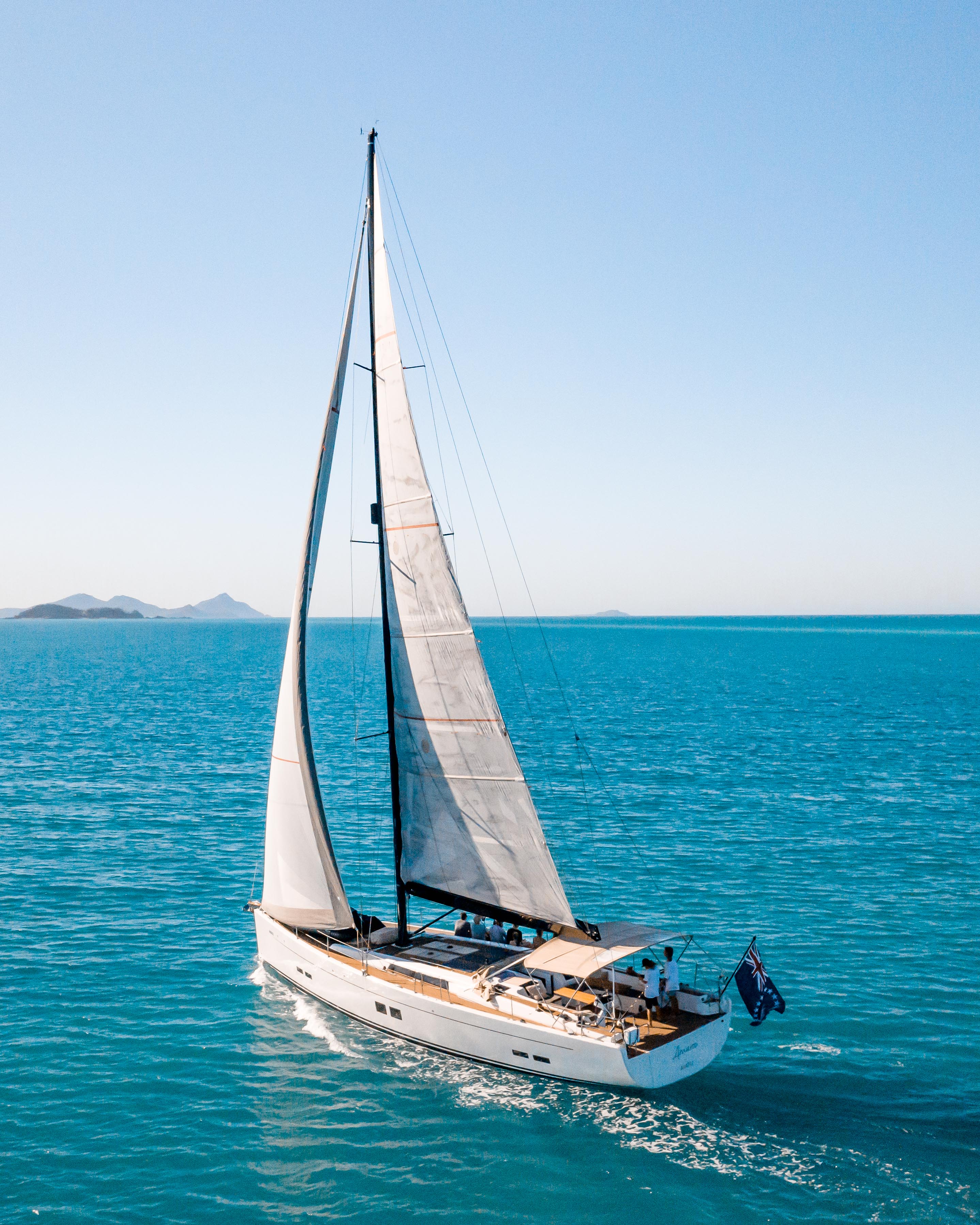 a luxury yacht against a blue sky