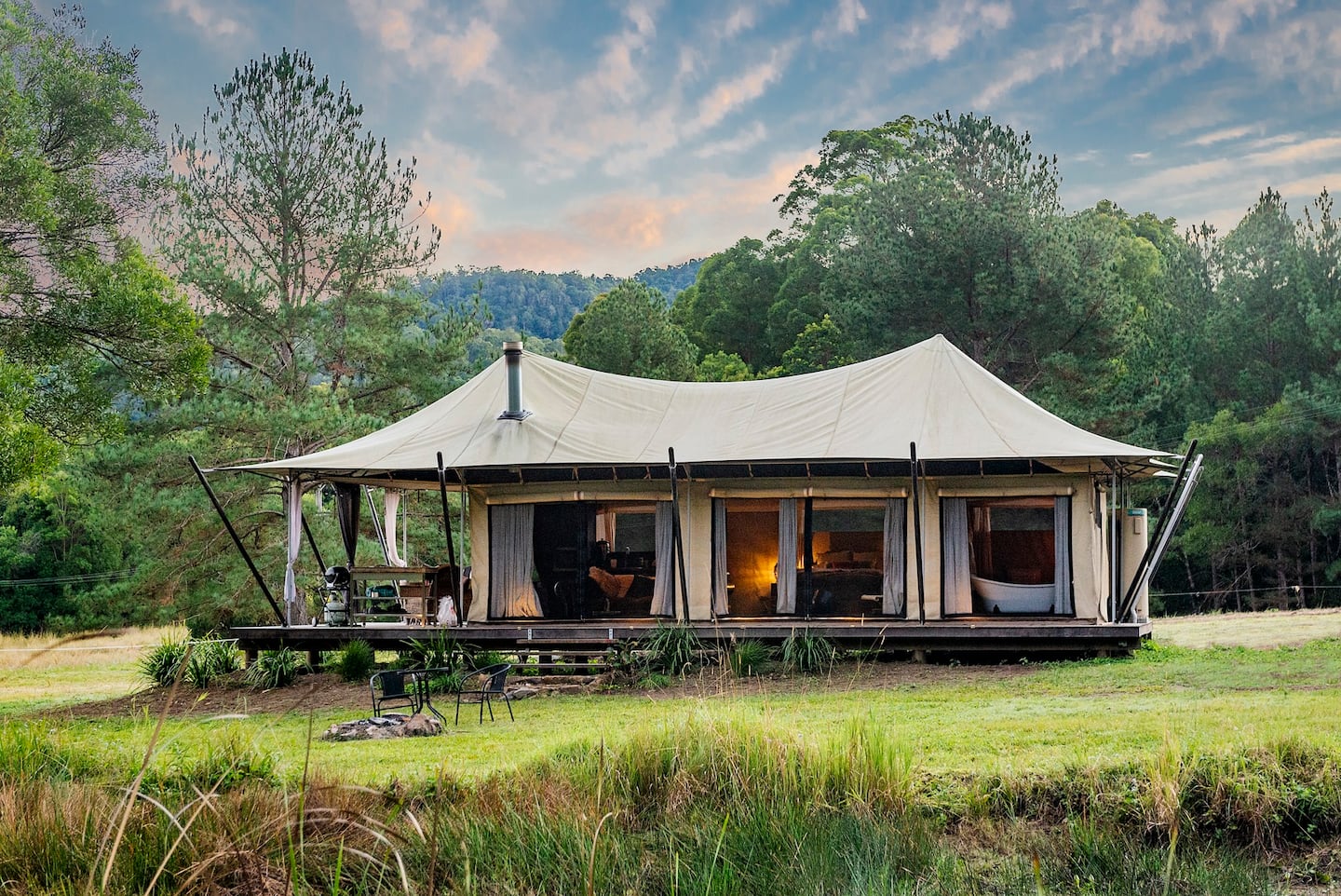 a large luxe tent in a paddock