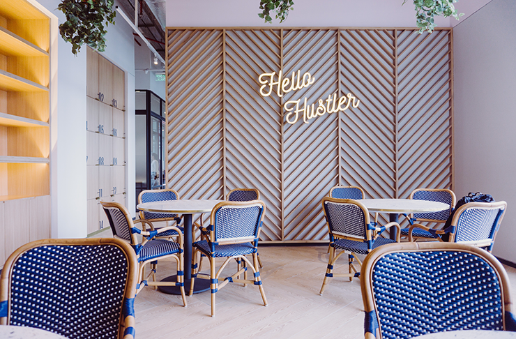 A colourful interior with a neon sign that reads 