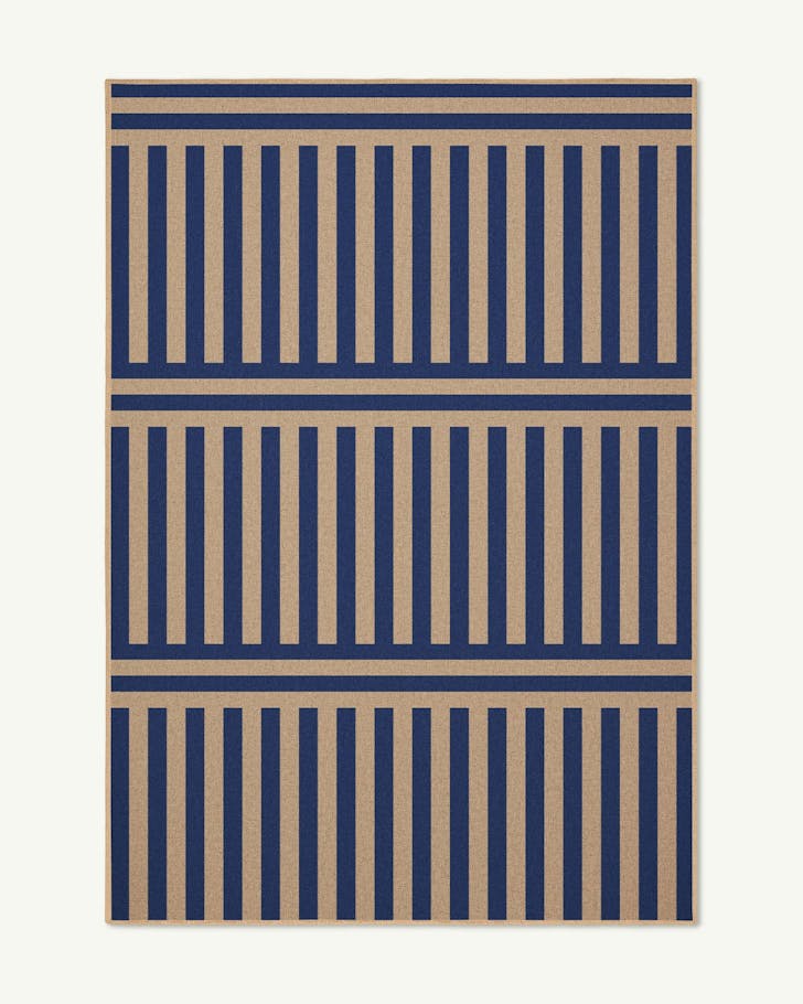 A blue and beige striped machine washable rug from double. 