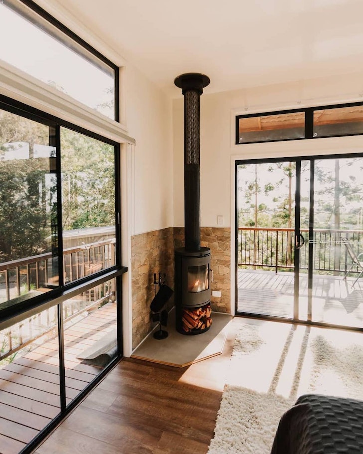 A view of the fireplace at a chalet in Rainforest Gardens, near Brisbane