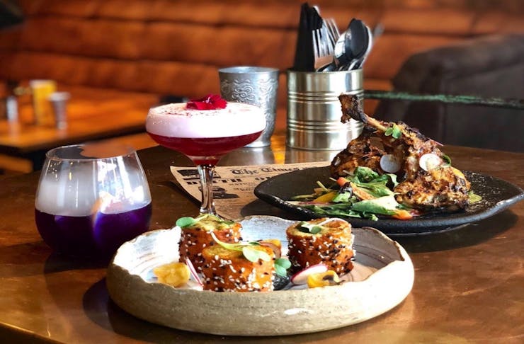 A delicious spread of cocktails and Indian-inspired meals.