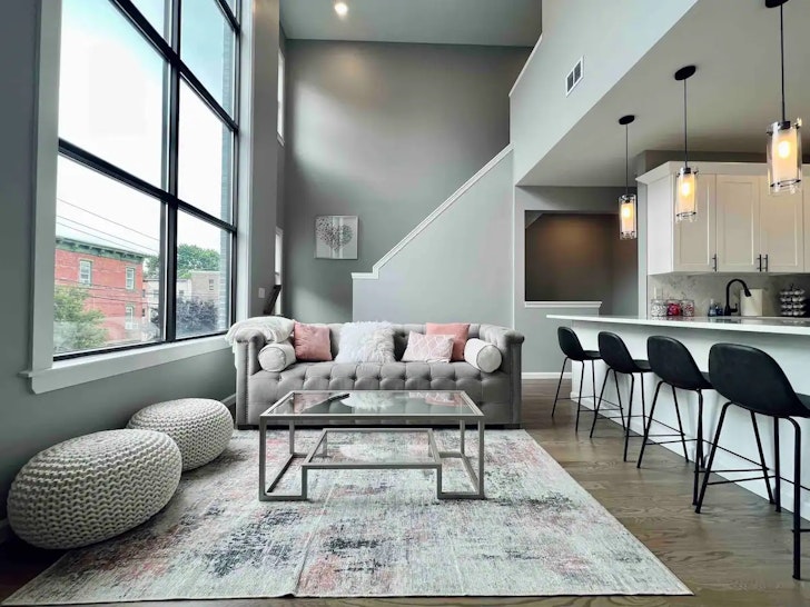 Couch in front of stairs