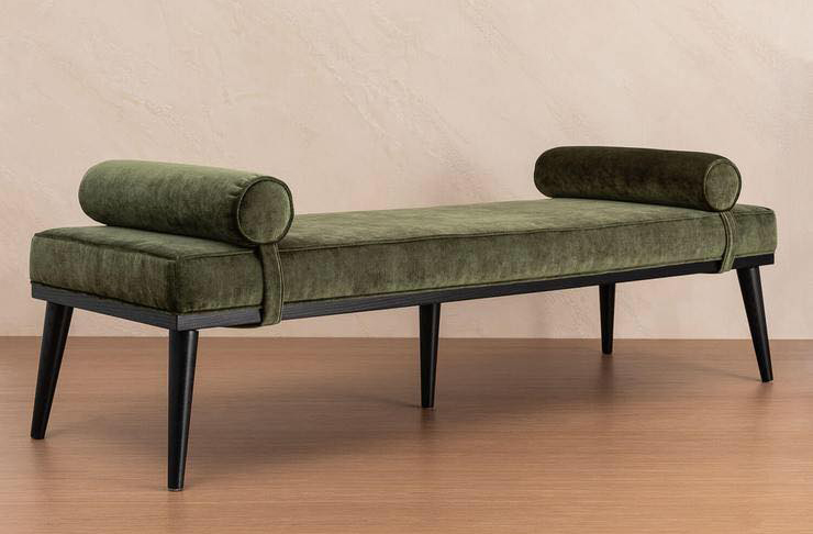 An image of a green velvet bench seat from Lore