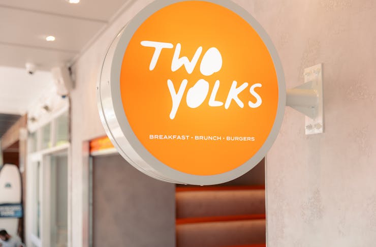 a sign that says 'two yolks'