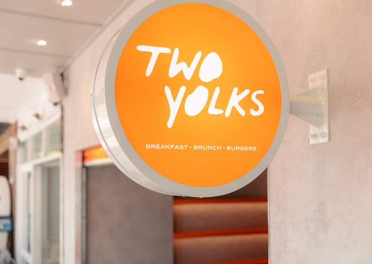 a sign that says 'two yolks'