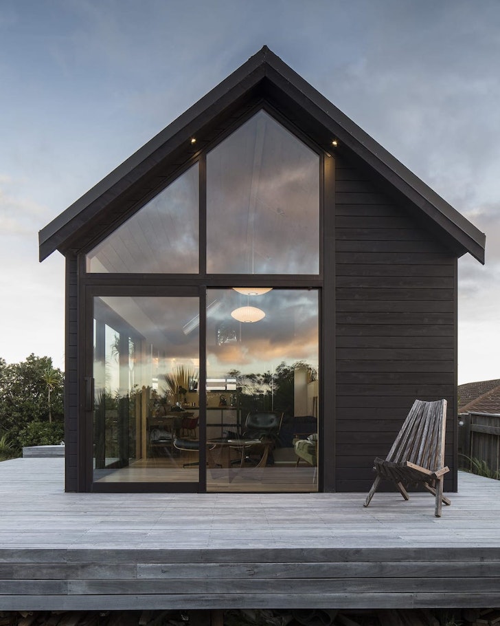 The dark-coloured exterior of Studio Seventy Four one of the best NZ Airbnbs