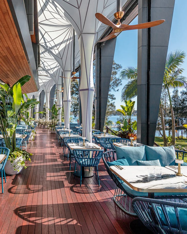 Open terrace table with lake views at 8 at Trinity