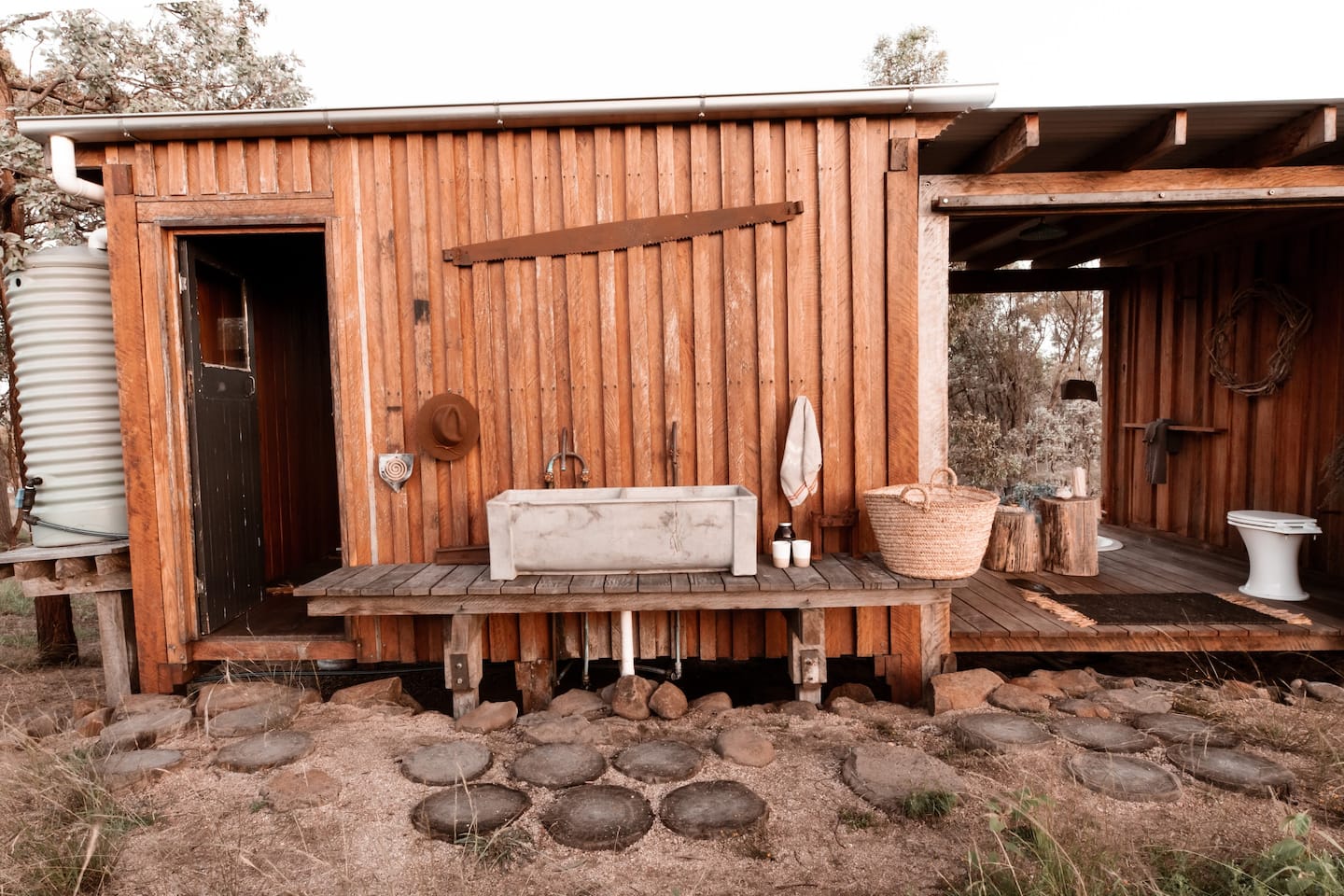 a rustic cabin in a farm setting