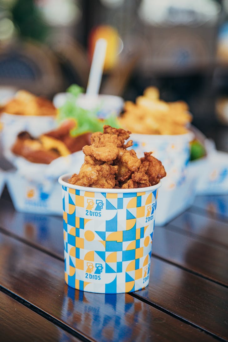 a cute blue bucket filled with chicken nuggets