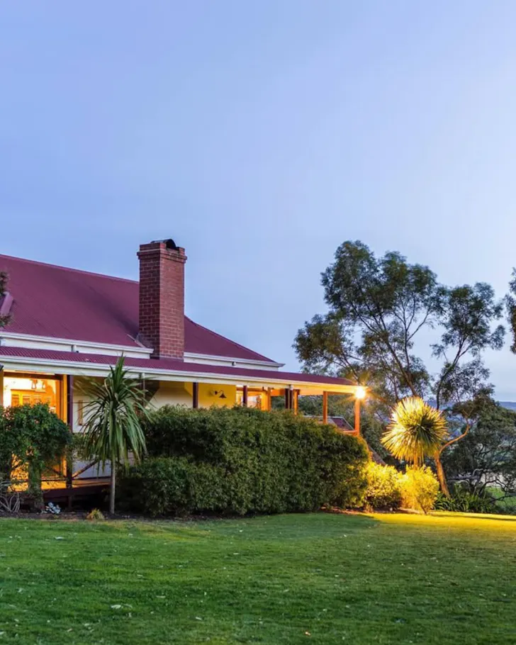 House in front of a bush