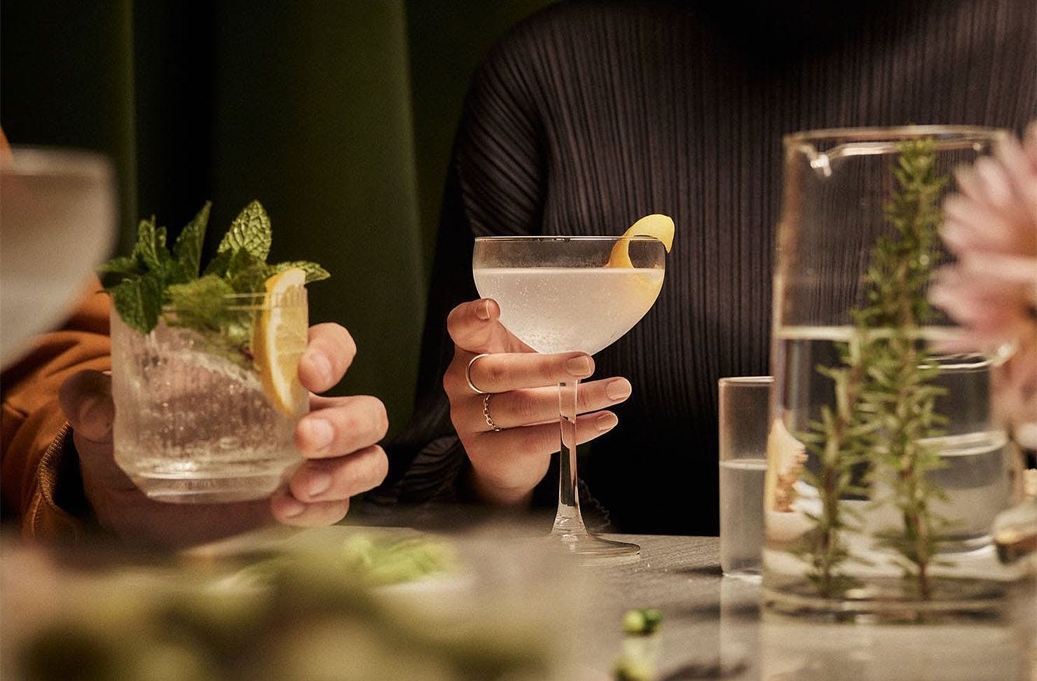 People hold AF Drinks cocktails in their hands.