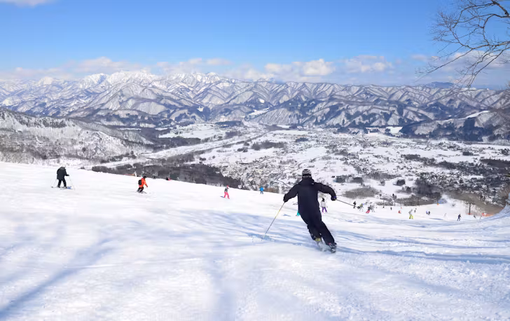 People skiing down hill