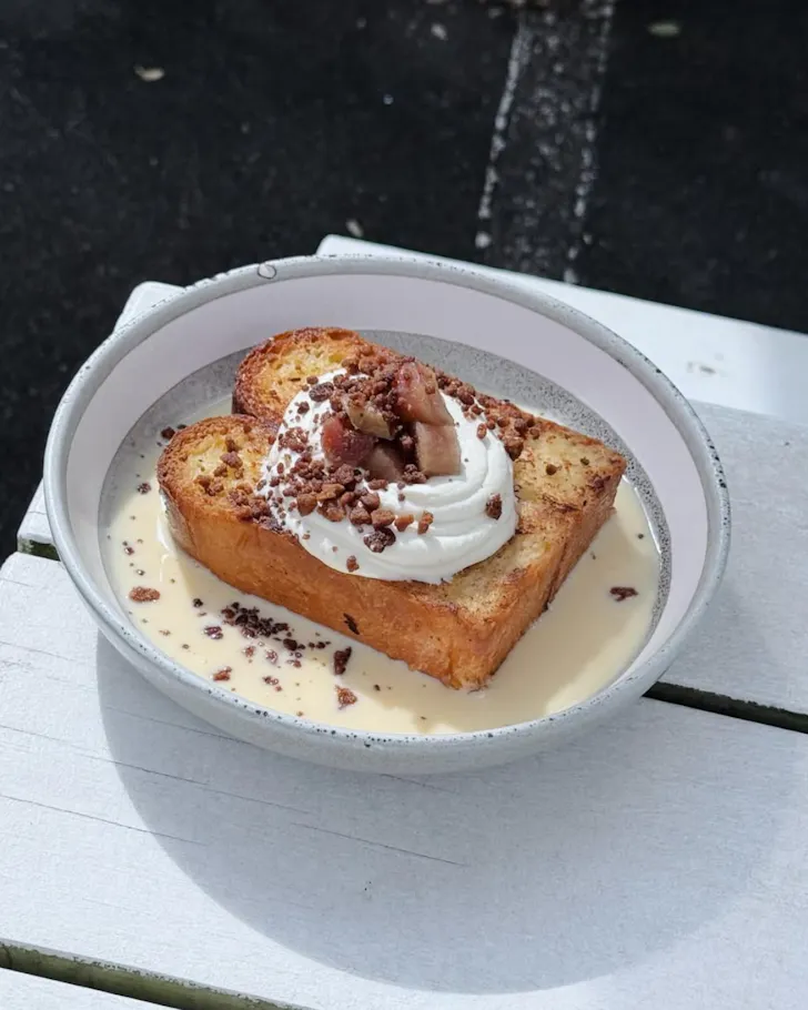 Plate of french toast on table corner
