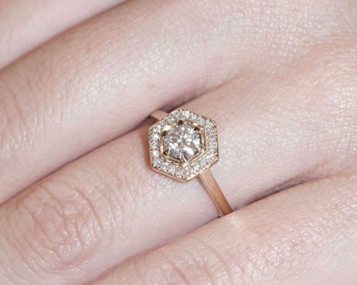 A hexagonal diamond ring from Meadowlark on a simple gold band