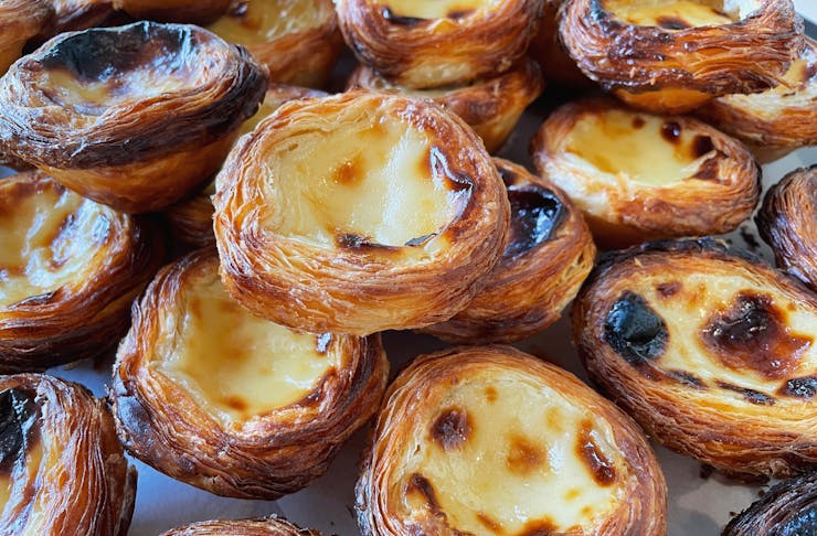 A tray piled with portuguese custard tarts