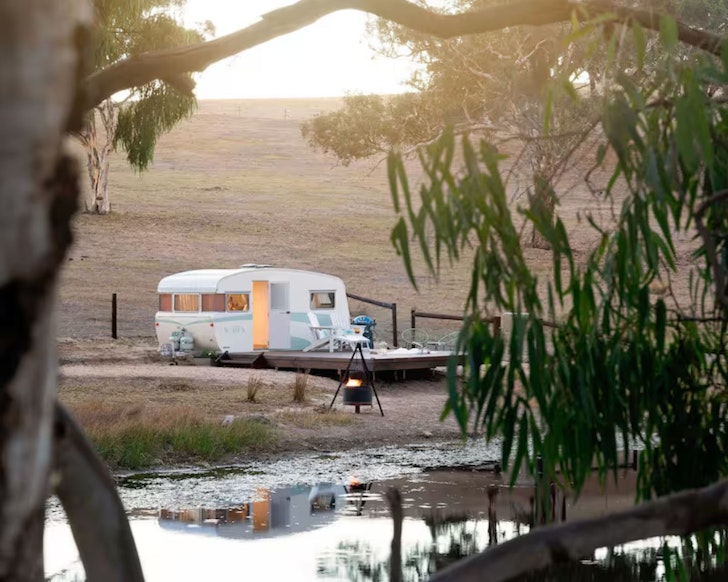 A view of Agatha retro caravan one of the best Airbnbs near Adelaide surrounded by farmland