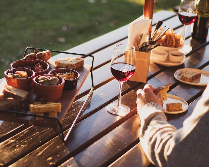 Someone tucks into a wonderful spread on the table at Ahiapao Eats in Matiatia Bay, Oneroa, Waiheke.