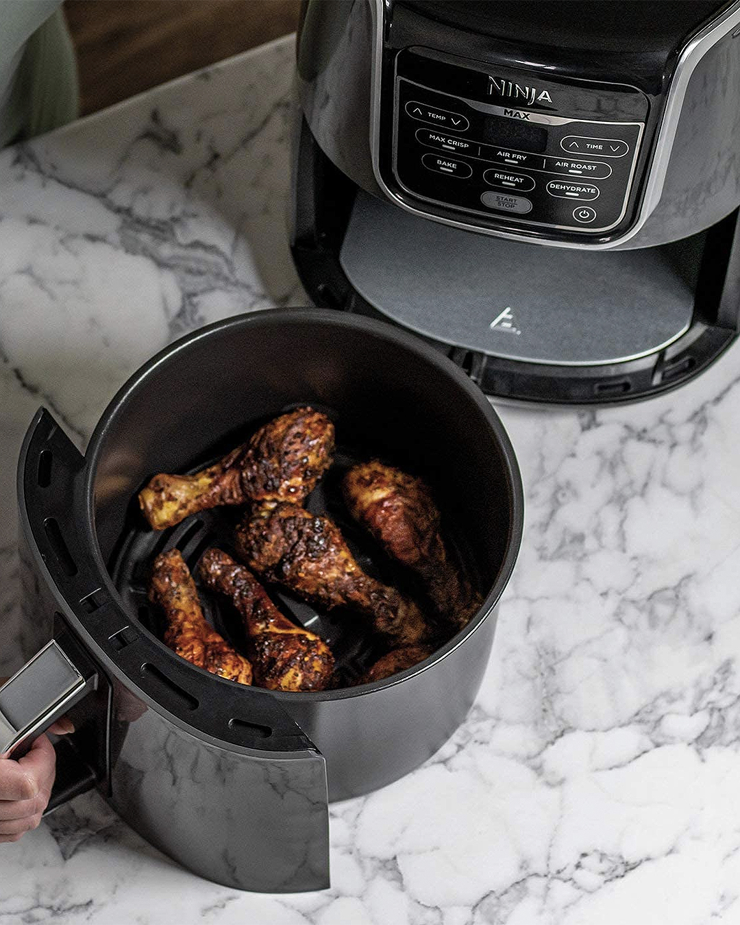 The Ninja Air Fryer Max with a bucket of fried chicken on display.