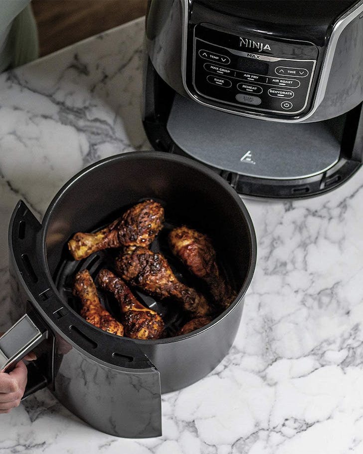 The Ninja Air Fryer Max with a bucket of fried chicken on display.