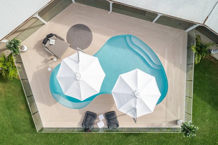 aerial view of pool and deck
